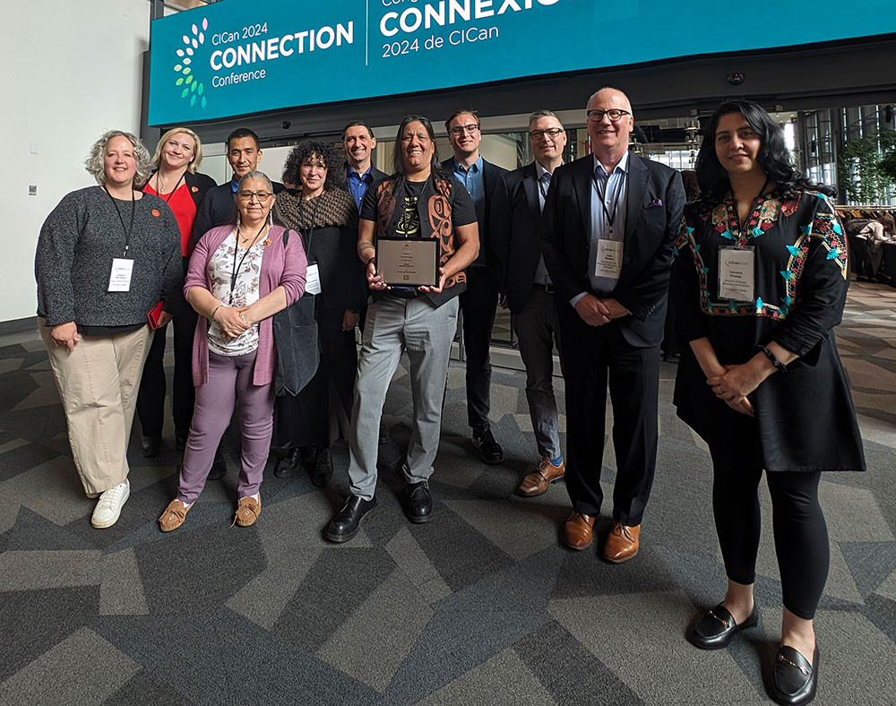լ CICAN Conference attendees with Indigenous Education bronze award